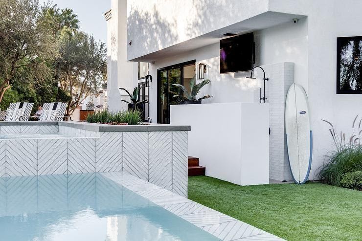 Above ground pool tiled with white herringbone tiles delivers a spa-like  finish to the outdoor backyard design. | Pool tile designs, Outdoor pool  shower, Pool tile